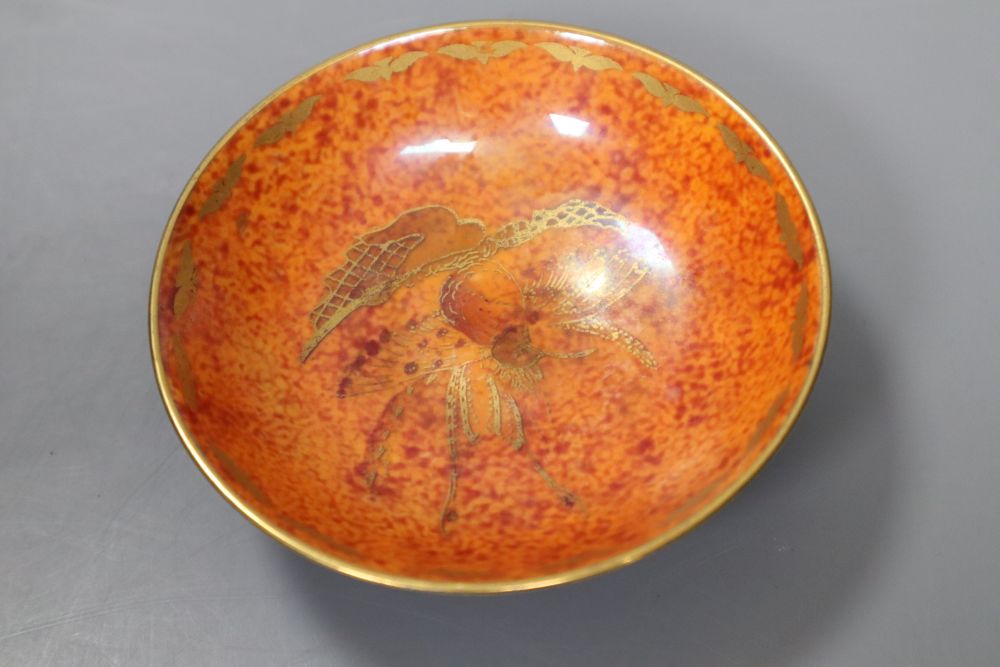 An orange glazed Wedgwood lustre dish, decorated with bird of paradise, diameter 9.5cm